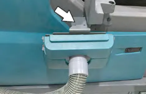 Arrow pointing to the hanging bracket where the live wand hose hangs