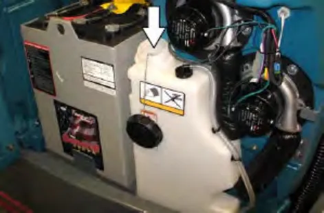 Detergent tank with an arrow pointing down to the tank fill cap