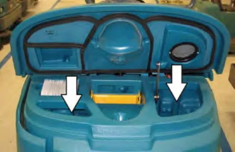 Open recovery tank cover with two arrows pointing into the tank at the areas to flush and the sensor to rinse