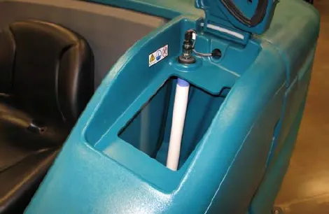 Open solution tank with the cover raised and the filler tube visible