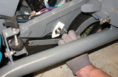 Hand removing the side skirt plate and side skirt from the Pre-Sweep assembly