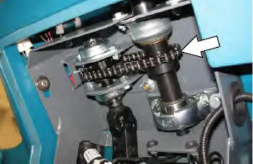 Steering chain under the control panel, with an arrow pointing to it
