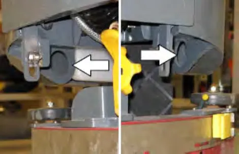 Two views of the rear jacking brackets with arrows pointing to the holes for the tie-down straps