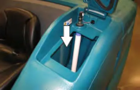 Solution tank fill opening with an arrow pointing down into the tank