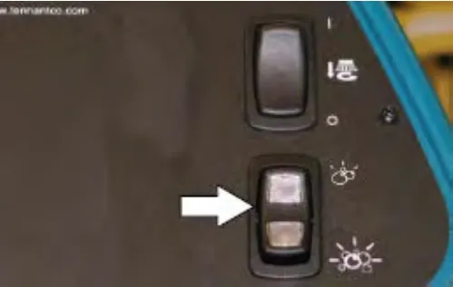 Switch panel with an arrow pointing at the lower rocker switch, the severe environment switch