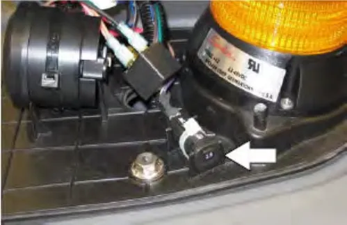 Circuit breaker 16 inside the optional light assembly, with an arrow pointing to it