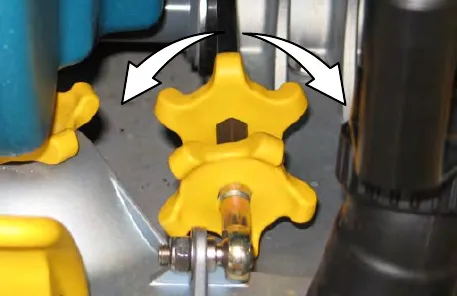 Squeegee tilt adjust knob with curved arrows showing it turned either way