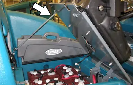 Seat held open by the seat support arm, with the battery compartment below