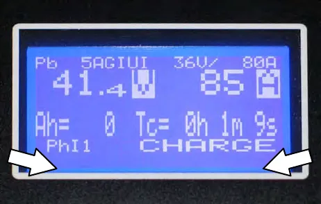 Charger display with arrows pointing to the bottom edge of the screen where fault codes appear