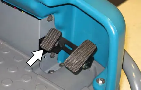 Foot pedals with an arrow to the brake pedal