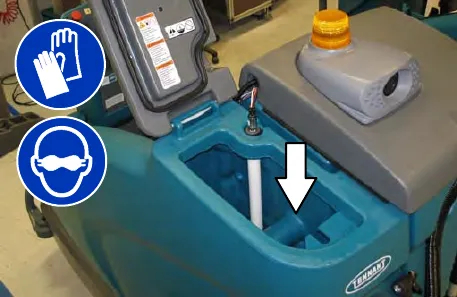 Solution tank fill opening with an arrow pointing down into it; gloves and eye protection are required