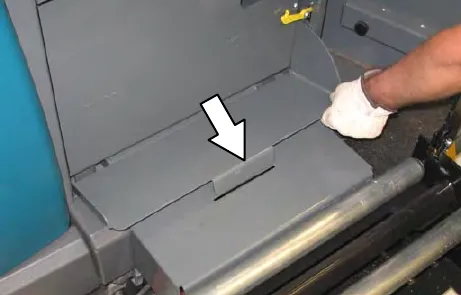 Retainer plate lowered, with an arrow to the retainer plate catch