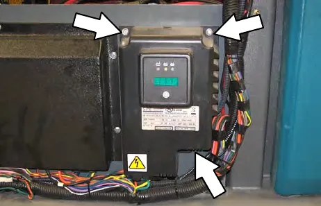 On-board battery charger with arrows pointing to its three mounting fasteners