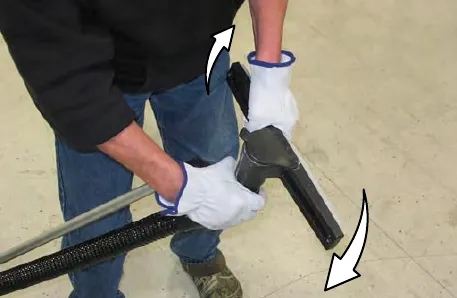 Vacuum nozzle being twisted to the vacuum position and the handle extended