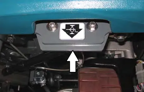 Front jacking point with the jacking label and an arrow pointing up to it