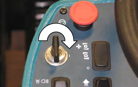 Key switch with an arrow showing the key turned clockwise to the on position