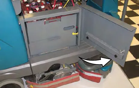 Battery compartment door opened, with an arrow to the door