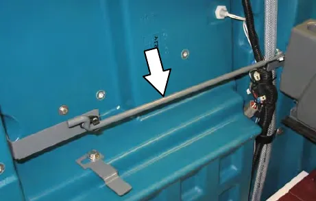 Seat support arm engaged in the hole in the operator seat plate