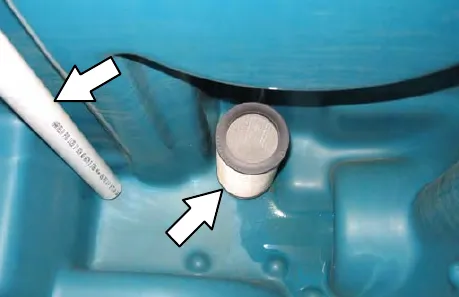 Filter and sensor inside the solution tank, with arrows to each