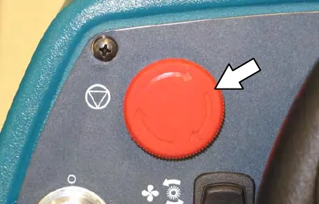 Red power kill switch on the control panel, with an arrow