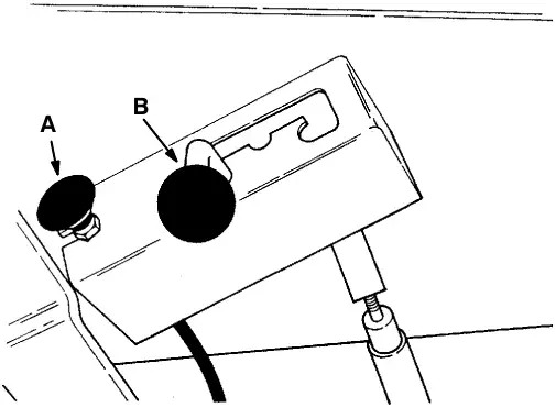 Scrub brush position lever, with the solution flow knob (A) and the lever in the raised position (B)