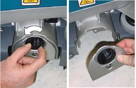 Turning the idler plate locking knob counter-clockwise, then lifting the idler plate off the brush base
