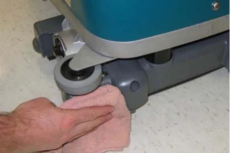 Wiping the machine body and wheel with a damp cloth