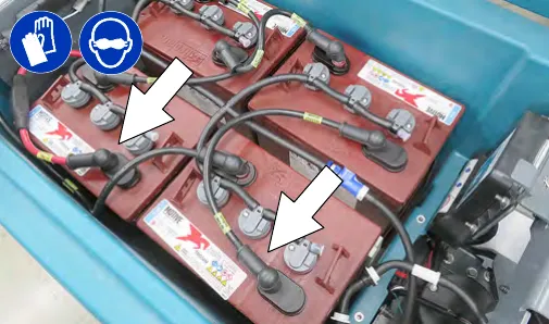 Disconnecting the battery cable connection at the machine