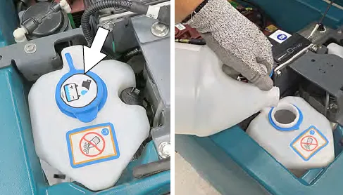 Removing the blue cap and pouring distilled water into the automatic battery watering tank