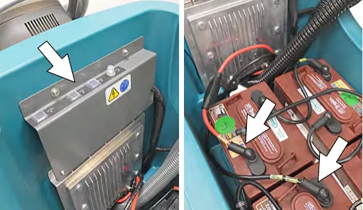 Circuit breaker panel near the battery compartment, marked by arrows