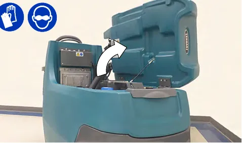 Recovery tank lifted to reach the battery compartment, with glove and eye protection symbols