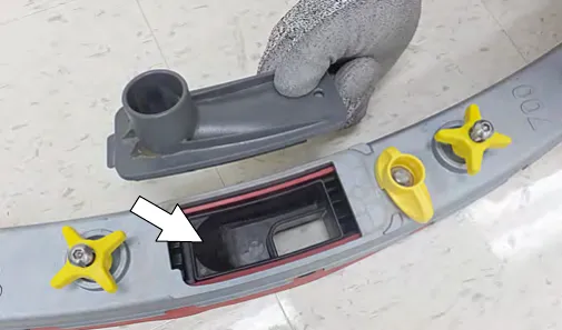 Drip trap cover removed from the squeegee assembly to clean the reservoir