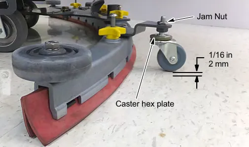 Caster hex plate and jam nut, with a 1/16 in (2 mm) space between caster and floor