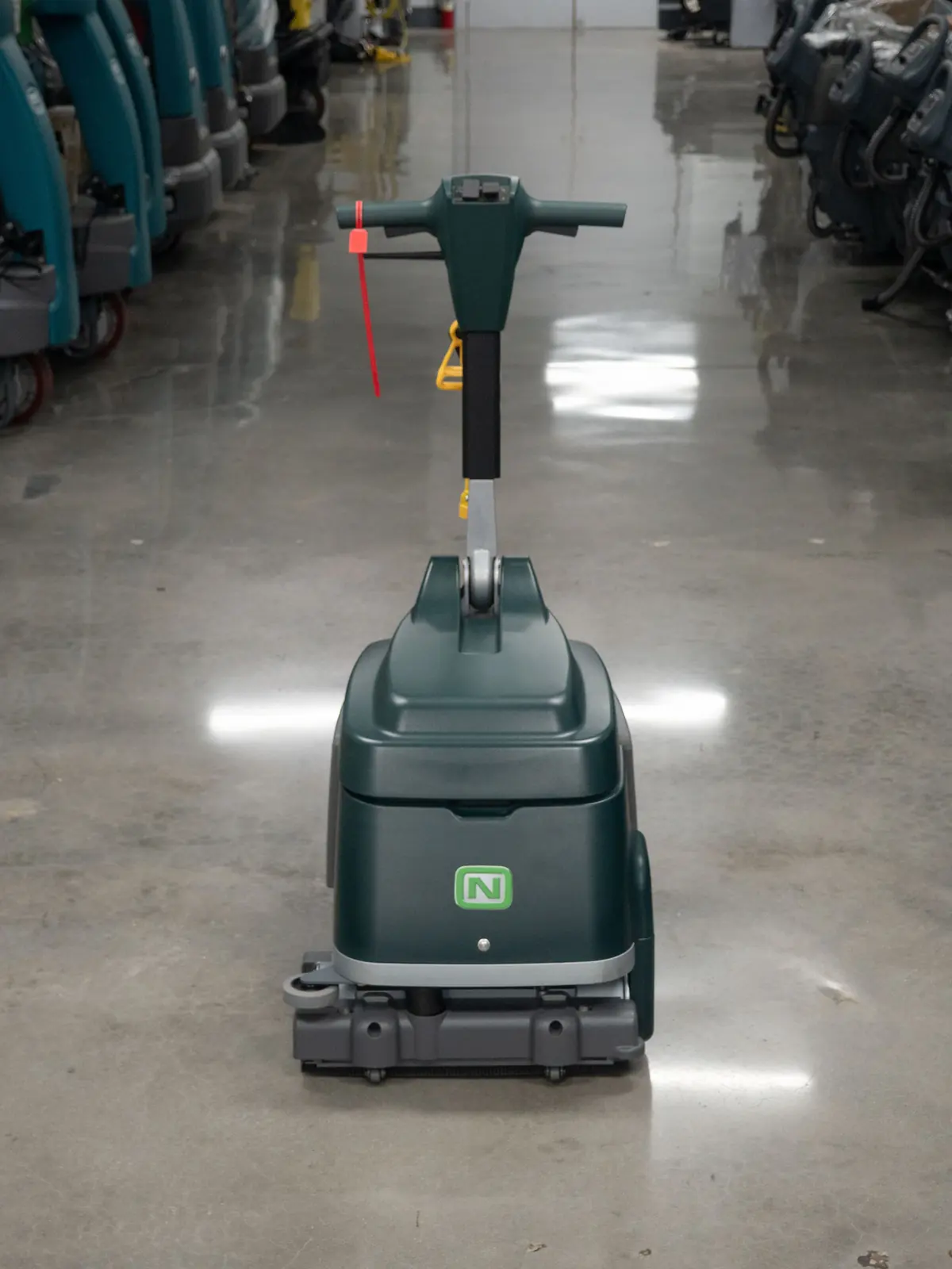 Tennant micro scrubber on a glossy floor