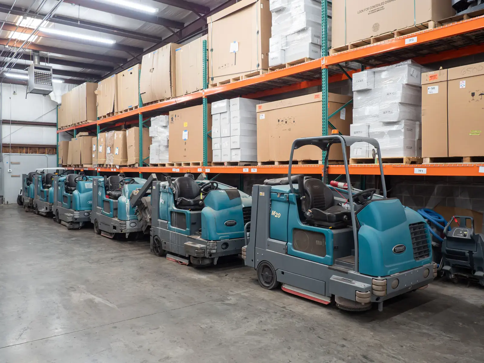 Tennant rider scrubbers lined up for service in the SES shop